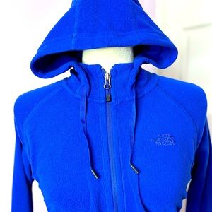 The North Face blue fleece full zip-up. Two pockets, hooves, women’s size medium